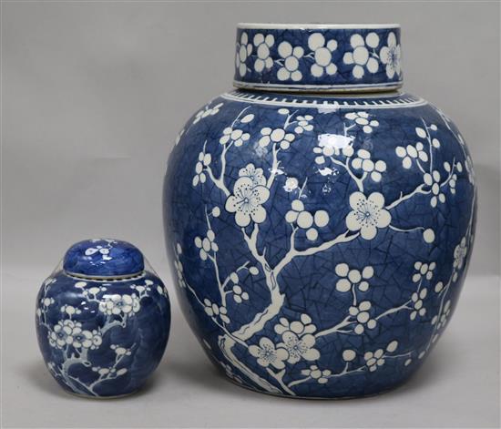 A large Chinese prunus jar and cover and another small jar